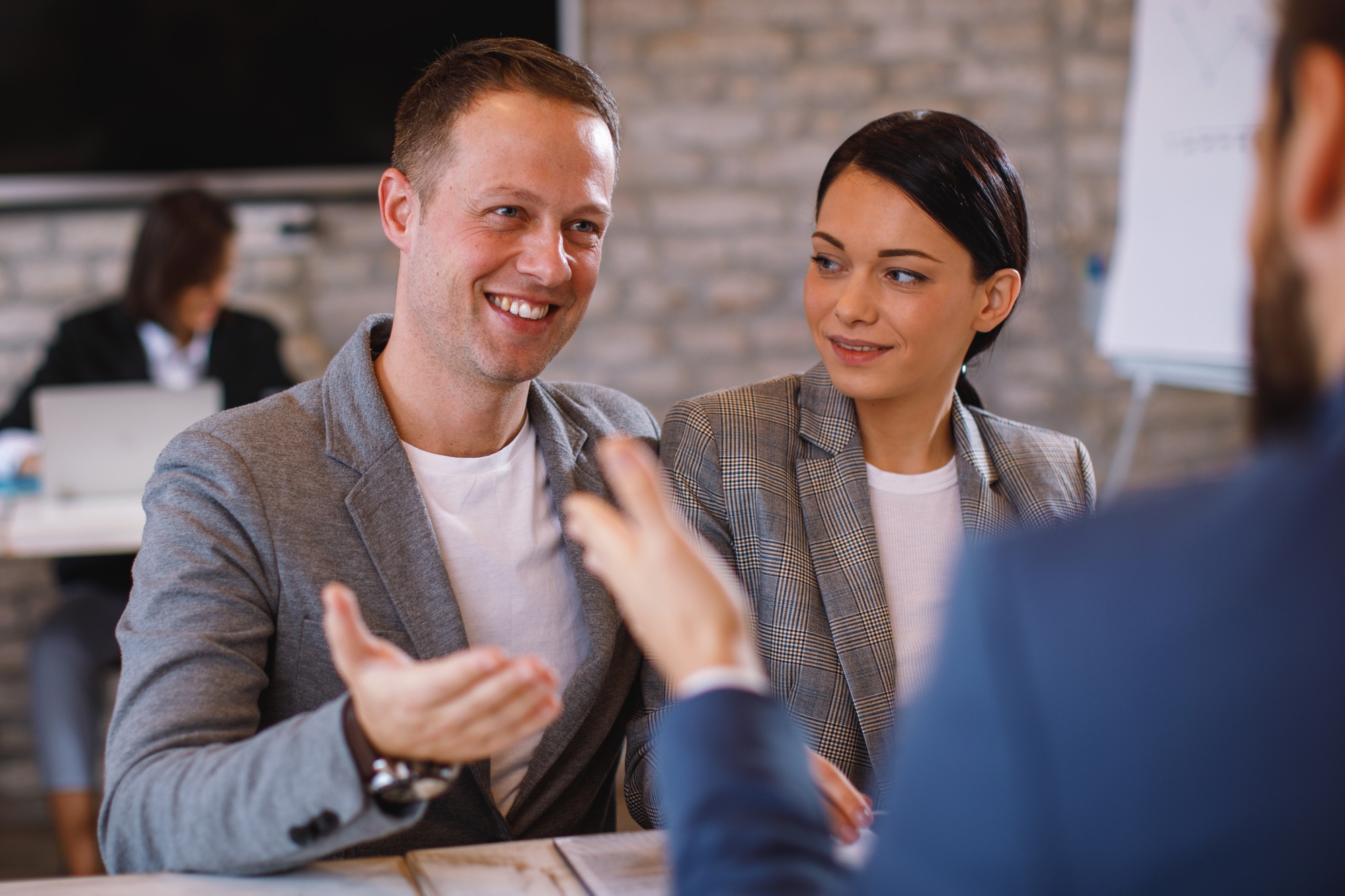 Young couple is negotiating with a bank loan manager